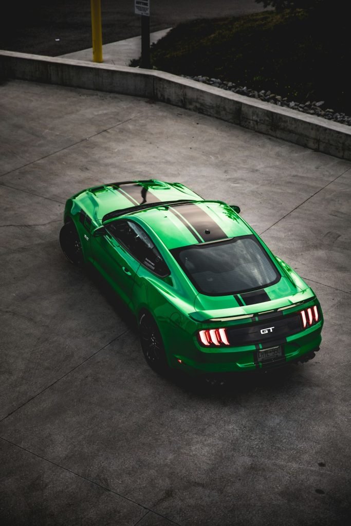 green-ford-mustang-on-road-o6yh-yac2ws